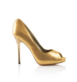 Golden Modern fashionable women shoe shot in studio