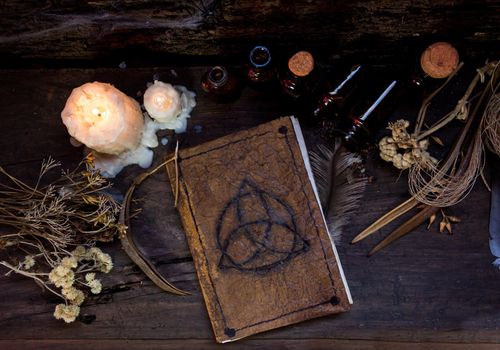 set of objects for witchcraft rituals, on rustic wood