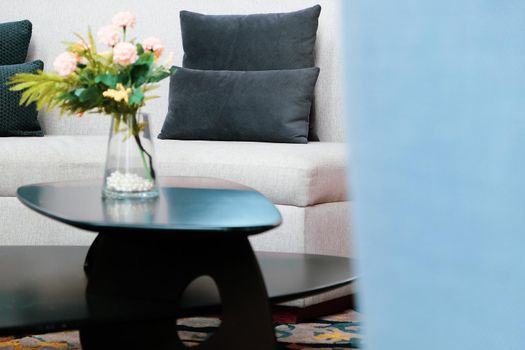 Pink Flower vase on table decoration in living room.