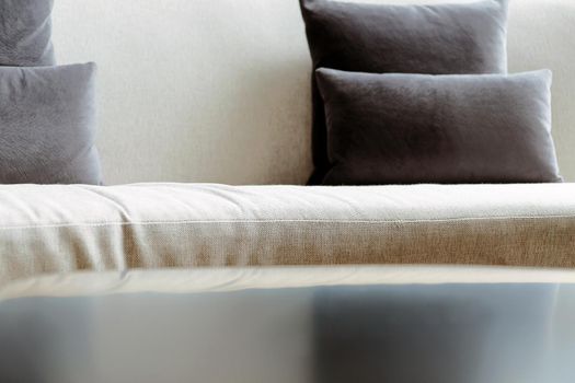 Detail image of cushion on sofa, modern living room.