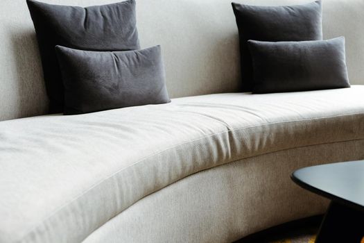 Detail image of cushion on sofa, modern living room.