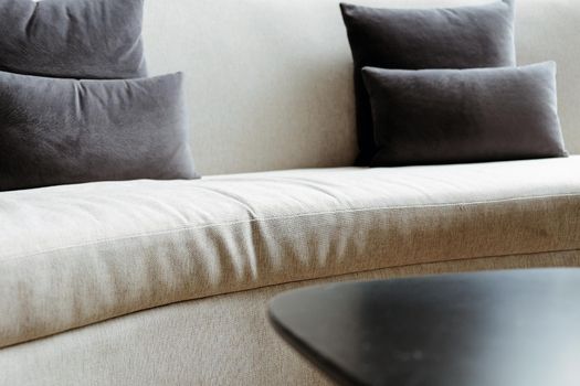 Detail image of cushion on sofa, modern living room.