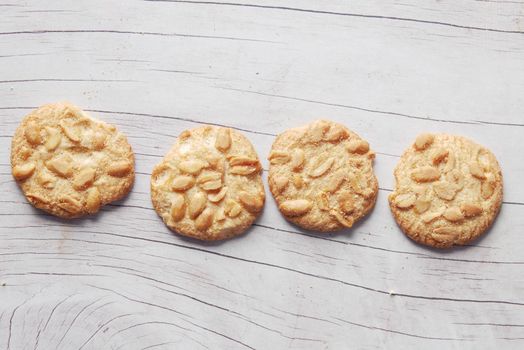 close up of peanut cookies on wooden table .