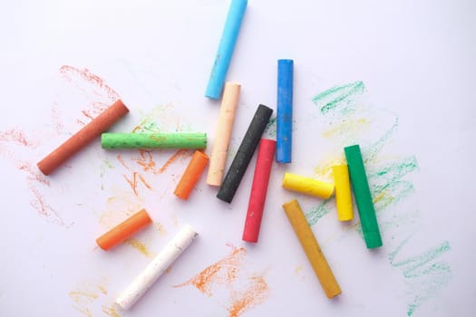 Color pencils on a papers on table .