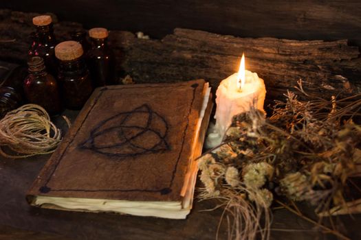 set of objects for witchcraft rituals, on rustic wood