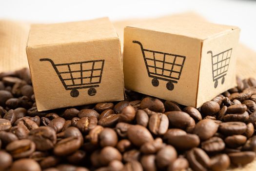 Box with shopping cart logo symbol on coffee beans, Import Export Shopping online or eCommerce delivery service store product shipping, trade, supplier concept.