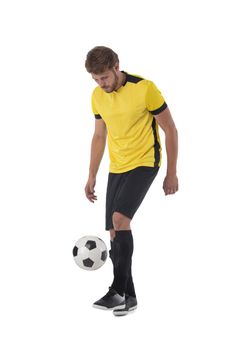 Caucasian soccer player man kicking ball isolated on white background