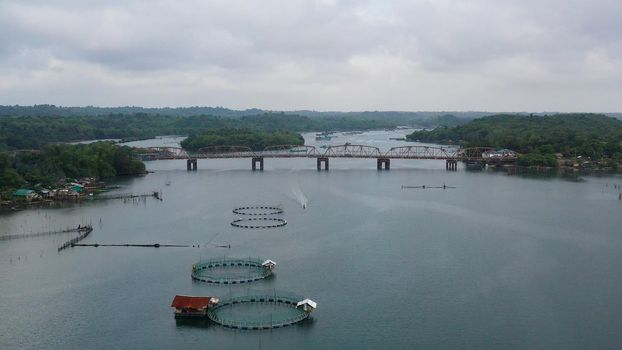 Aerial view of fish ponds for bangus, milkfish. Fish farm, top view. large scale traditional floating fish farms.