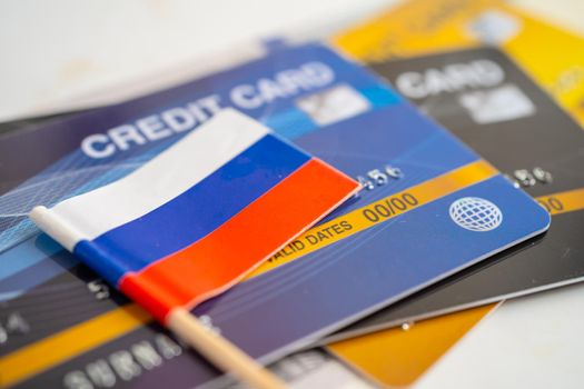 Russia flag on credit card. Finance development, Banking Account, Statistics, Investment Analytic research data economy, Stock exchange trading, Business company concept.