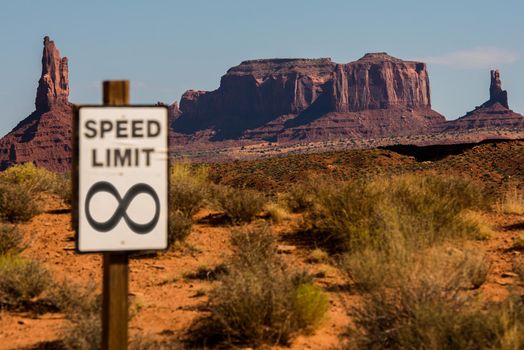 Infinity sign with Monument Valley scene in the background