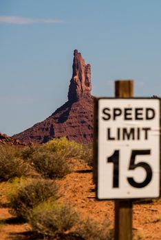 Monument valley speed limit with butte in background. Vertical crop