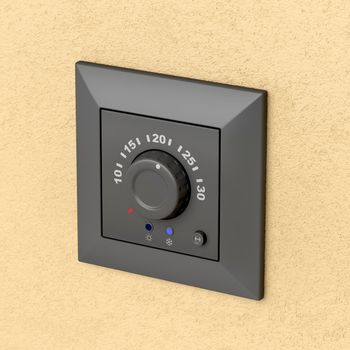 Black analog thermostat on the wall