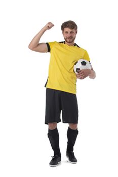 Soccer player is holding ball showing muscle holding fist celebrating victory isolated on white background