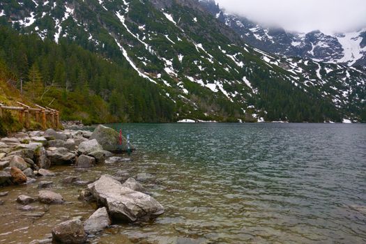 View of a mountain lake with clear turquoise water