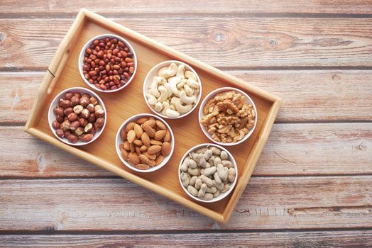 peanut, hazelnut walnut , cashew nut and almond in a container ,