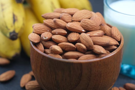 Close up of almond nuts in a bowl .