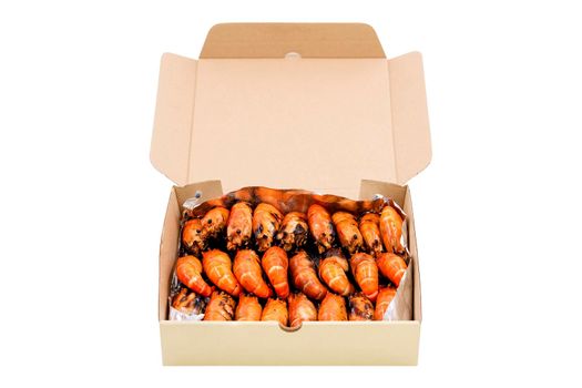 Group of grilled river prawns arrange in a paper box isolated on white background.