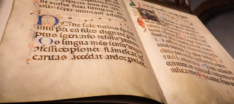 TURIN, ITALY - CIRCA MAY 2021: antique Medieval manuscript with ancient calligraphy.