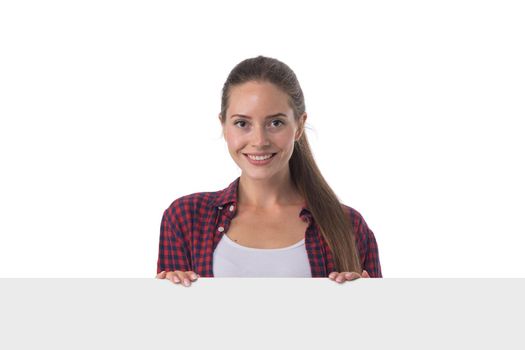 Woman billboard sign. Young beautiful woman smiling showing blank white placard. Casual caucasian female model with friendly smile. Isolated on white background