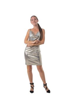 Stylish young blonde woman dancing in silver shiny dress. Full body length portrait isolated on white studio background.