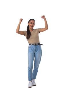 Happy pretty young girl wearing casual clothes posing with fists up gesturing yes isolated on white background