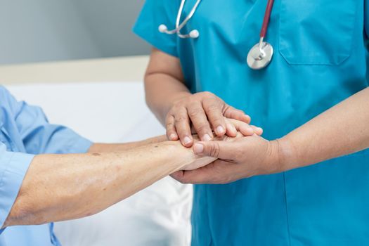 Holding hands Asian senior or elderly old lady woman patient with love, care, encourage and empathy at nursing hospital ward, healthy strong medical concept