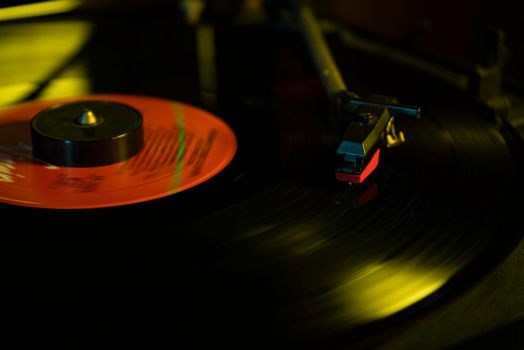 Turntable with vinyl record detail in low light picture