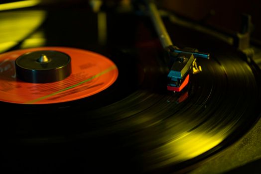 Turntable with vinyl record detail in low light picture