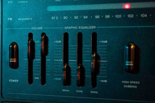 Volume and equalizer controller detail in an old stereo equipment