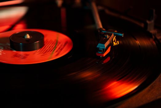 Turntable with vinyl record detail in low light picture