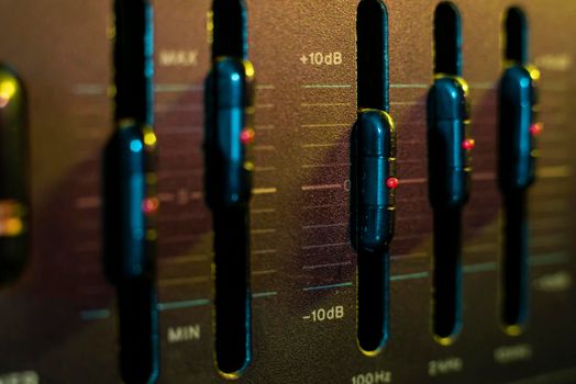 Volume and equalizer controller detail in an old stereo equipment