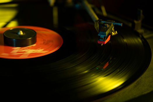 Turntable with vinyl record detail in low light picture