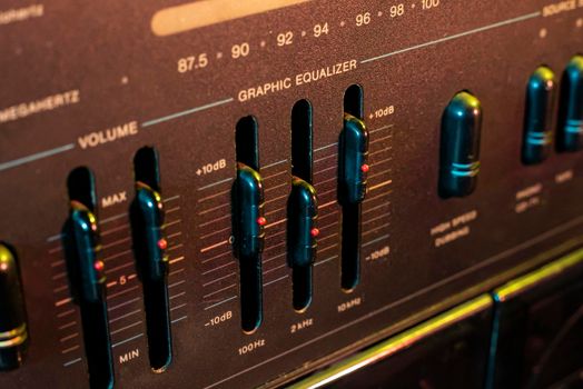 Volume and equalizer controller detail in an old stereo equipment