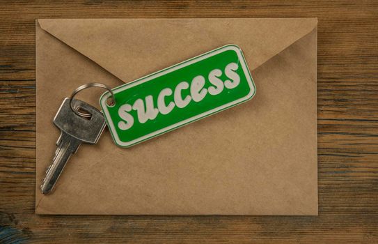 Silver key to success concept with label or tag