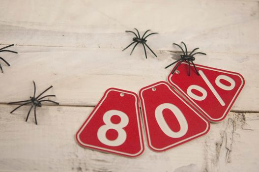 eighty percent discount on the Halloween background-price tag on a rustic old white wooden background