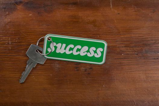 Silver key to success concept with label or tag