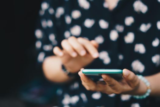 Woman hand using smartphone to do work business, social network, communication concept.