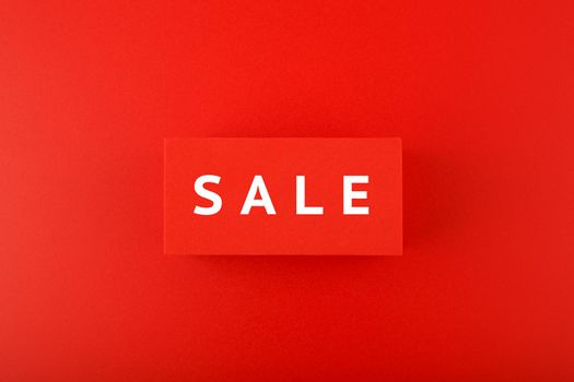 Sale elegant minimal concept in red colors. Sale written on red tablets on red background. 