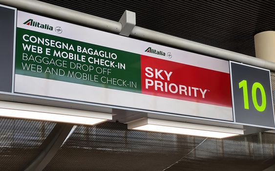 Catania, Italy, August 2021: Information panel of the Alitalia desk inside the Catania airport. Luggage drop off and check in. The Alitalia airline will end its operations on October 14, 2021