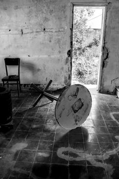 Abandoned house with broken furniture in the gold mines of Rodalquilar village in Almeria province, Spain.