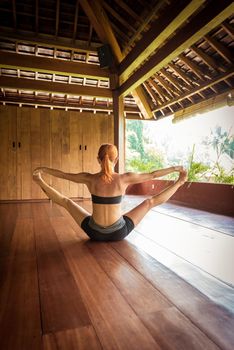 Indoor shot of a young yoga instructor doing asanas