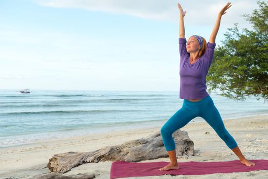 Young woman practicing yoga at exotic Bali location