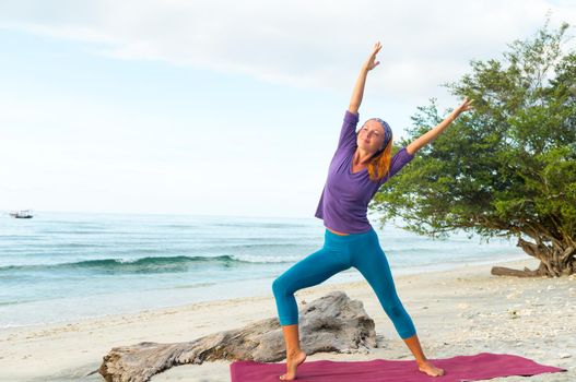 Young woman practicing yoga at exotic Bali location