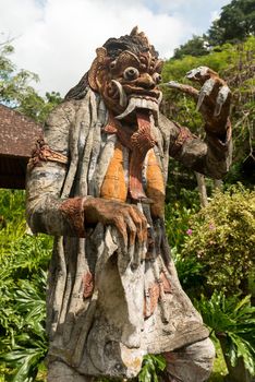 Closeup of traditional Balinese God statue in Central Bali temple