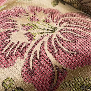 Fabric background with floral pattern macro shot