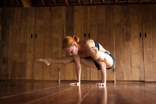 Indoor shot of a young yoga instructor doing asanas