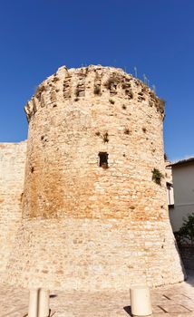San Sisto gate in Spello with roman defensive tower , beautiful old medieval walled town