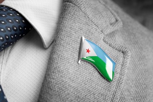 Metal badge with the flag of Djibouti on a suit lapel.