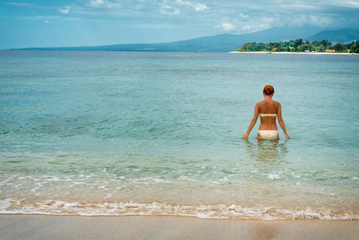 Woman enjoying her time at tropical island beach