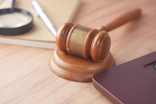 Top view of gavel and book with copy space on table .